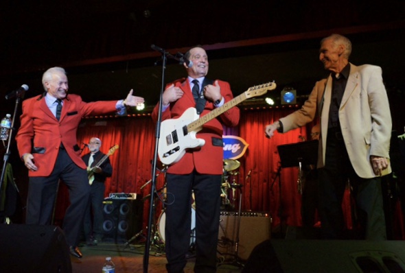 The Jersey Four performing in red jackets